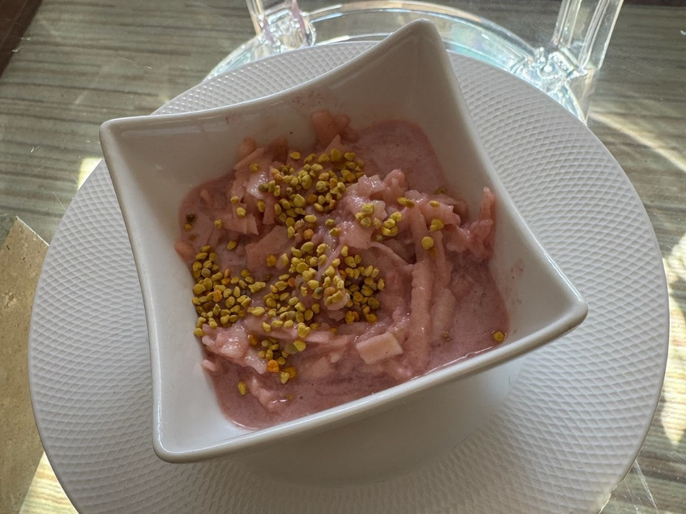 A homemade Protelicious creation — a protein-rich strawberry bowl topped with bee pollen